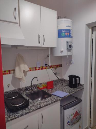a kitchen with a sink and a counter top at San Juan Apart in Santa Lucía