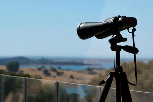 a camera on a tripod with a view of a field at Montimerso Skyscape Countryhouse in Monsaraz