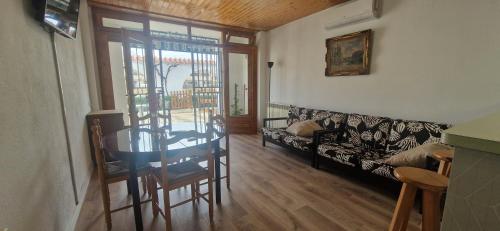 a living room with a couch and a table at Apartamento en L´Ampolla in L'Ampolla