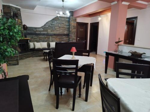 a dining room with a table and chairs at Pozar Salt Cave Hotel Spa in Kato Loutraki