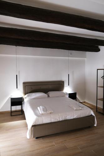 a bedroom with a large bed with two night stands at Toledo 292 Luxury House in Naples
