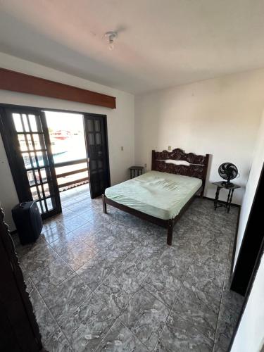 Cama o camas de una habitación en Aconchegante Apartamento na Praia