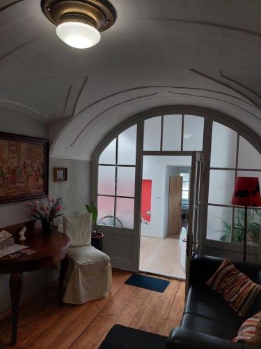 a living room with a couch and a table at Penzion David in Třešť