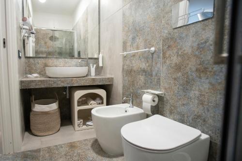 a bathroom with a toilet and a sink at Guest House Azzurra in Lampedusa