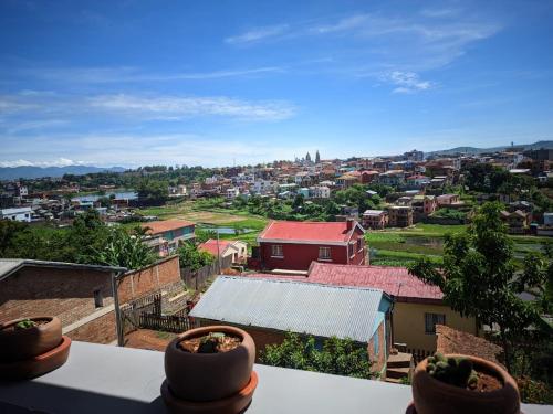 a view of a city from a balcony at TOKY Hôtel in Antsirabe