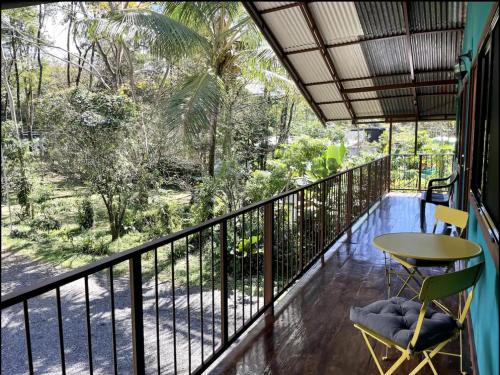 a balcony with a table and chairs on it at Casa Patricia in Uvita