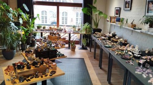 a room filled with lots of figurines on tables at De Verloren Gernoare in De Panne