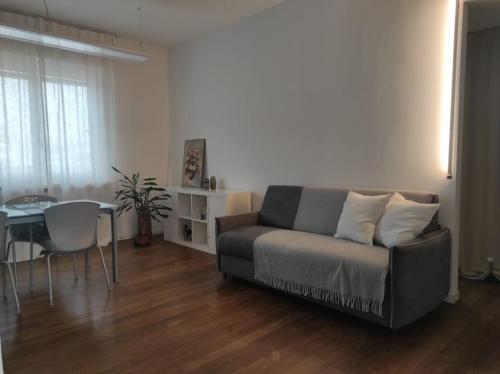 a living room with a couch and a table at Appartamento - Rho Centro 6 - in Rho