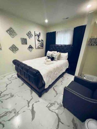 a bedroom with a king sized bed with a large carpet at Beautiful Queen Luxury Suite Near Downtown Norfolk in Norfolk