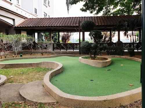 a miniature golf course with a tree in the middle at Mahkota Timber Heaven 6pax Historical Spot Jonker in Melaka