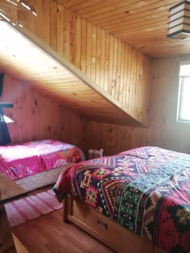 Ein Bett oder Betten in einem Zimmer der Unterkunft Valle el Abra Ralún Lodge