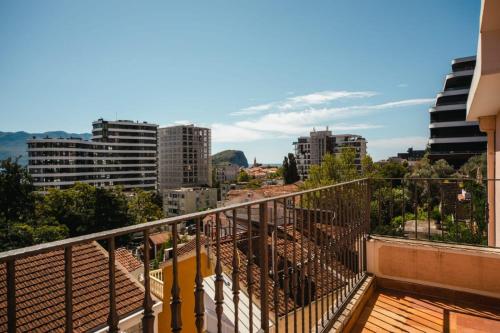 a balcony with a view of a city at Harmony Budva Apartment in Budva