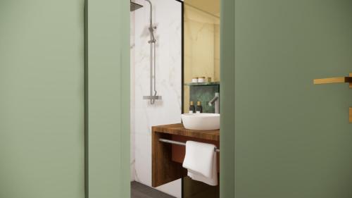 a bathroom with a sink and a mirror at Fletcher Hotel Restaurant De Mallejan in Vierhouten