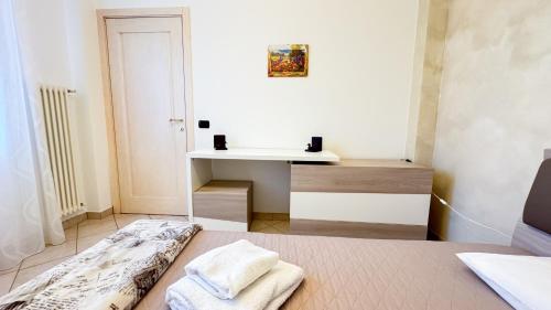 a room with a bed and a sink in it at Lady Teresa Apartment by Ca-Sa Check in Chioggia