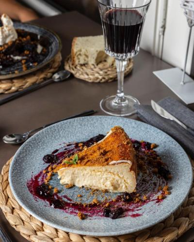 a piece of cake on a plate on a table at Hotel rural Finca Vivaldi Nature & Spa in San Miguel de las Dueñas