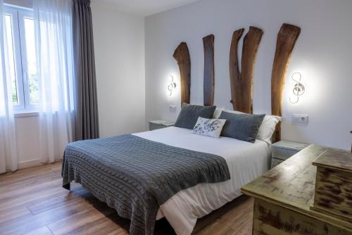 Postel nebo postele na pokoji v ubytování Hotel rural Finca Vivaldi Nature & Spa