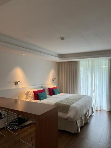 Una cama o camas en una habitación de Ilum Experience Home