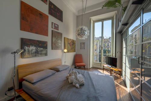 a bedroom with a bed with a stuffed animal on it at [Centro] Splendido Appartamento di Design in Turin