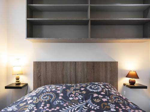 Ένα ή περισσότερα κρεβάτια σε δωμάτιο στο Residence Louis Quartier Gare