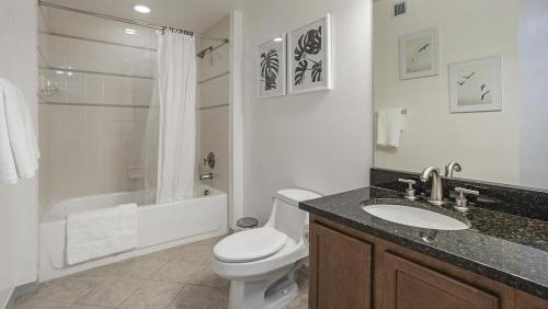 a bathroom with a toilet and a sink and a shower at Landing Modern Apartment with Amazing Amenities (ID7763) in Fort Lauderdale