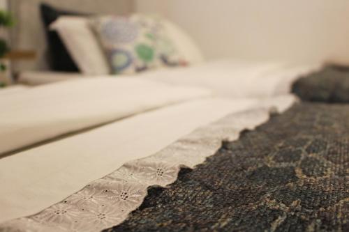 a close up of a blanket on a bed at Apartamento Centro de Pontevedra in Pontevedra