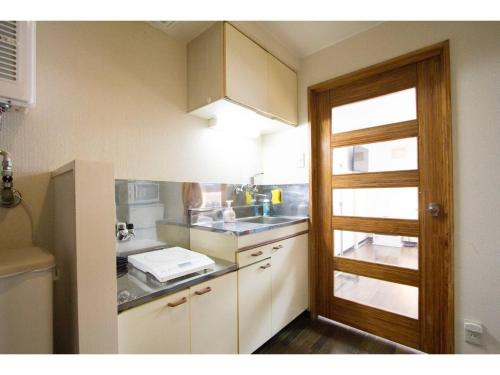 a small kitchen with a sink and a counter at Haimu Shanzerize 7,12 - Vacation STAY 11293 in Sapporo
