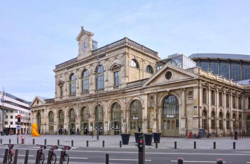 a large building with a clock tower on top of it at Old Lille - Superb apartment 2 bedrooms. in Lille