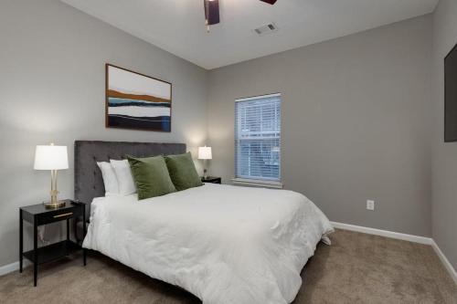 a bedroom with a large white bed and a window at Landing Modern Apartment with Amazing Amenities (ID4329) in Mount Juliet