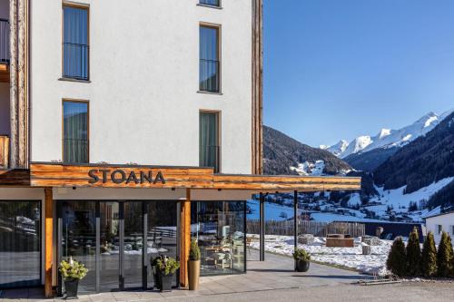 a hotel with a sign that reads stanza at Stoana Apt 1-1 in San Giacomo