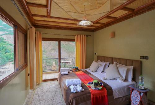 Postel nebo postele na pokoji v ubytování auberge atlas tamatertt