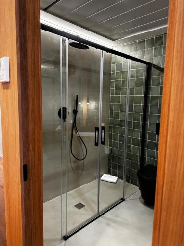 a shower in a bathroom with a glass door at Reyes Católicos Premium Beach, Playa Urbanova, Alicante in Alicante