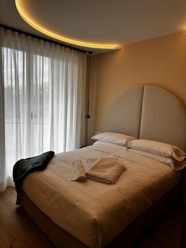 a bedroom with a large bed with a large window at Reyes Católicos Premium Beach, Playa Urbanova, Alicante in Alicante