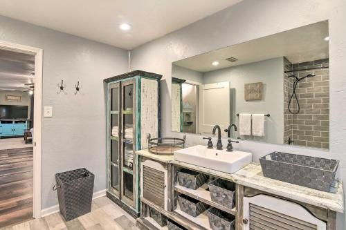 a bathroom with a sink and a mirror at Families, Groups, Pets! Galveston Gem 2 Mi to Sand in Galveston