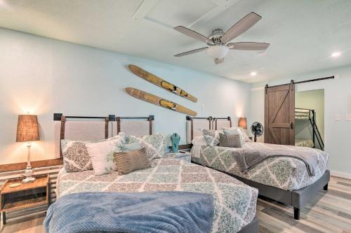 a bedroom with two beds and a ceiling fan at Families, Groups, Pets! Galveston Gem 2 Mi to Sand in Galveston