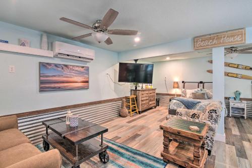 a living room with a couch and a tv at Families, Groups, Pets! Galveston Gem 2 Mi to Sand in Galveston