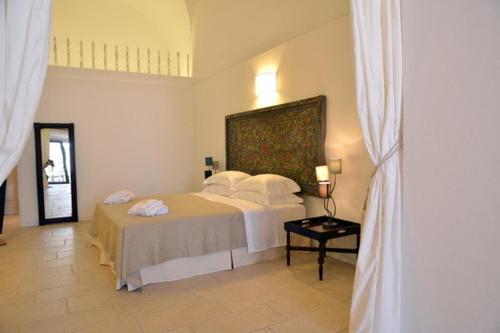 Letto o letti in una camera di Masseria Palane