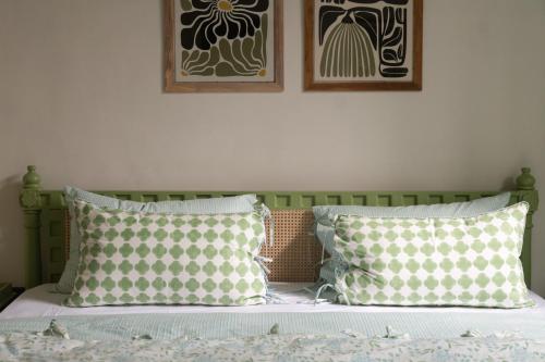 Una cama o camas en una habitación de Rajan House
