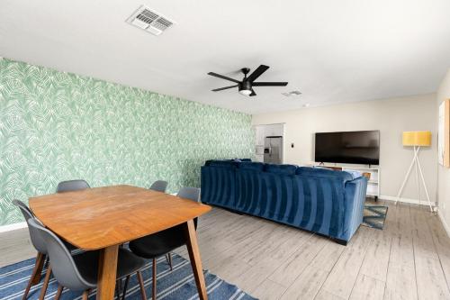 a living room with a table and a couch at Casa Azul in Mesa