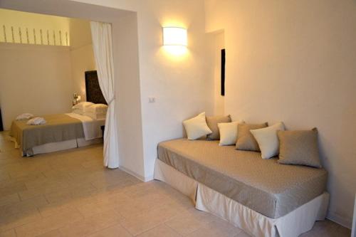 Letto o letti in una camera di Masseria Palane
