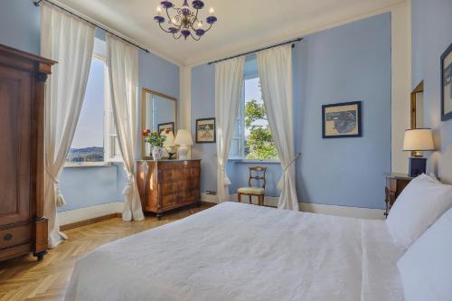 Ένα ή περισσότερα κρεβάτια σε δωμάτιο στο Villa Pedone