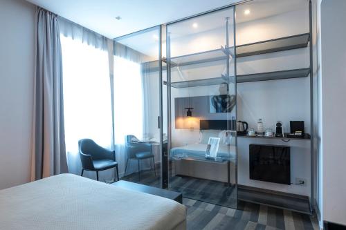 a hotel room with a bed and a fireplace at HOTIDAY Room Collection - Olbia Wallure in Olbia