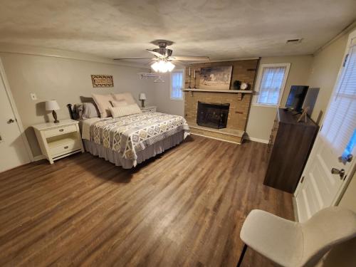 a bedroom with a bed and a fireplace at Andrea Abode in Lexington