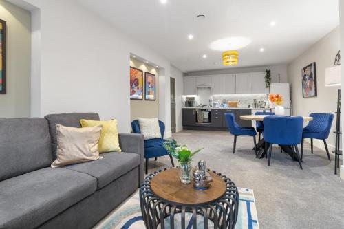 a living room with a couch and a table at WhiskAwayStays - Victoria House - Apartment 5 in Worcester