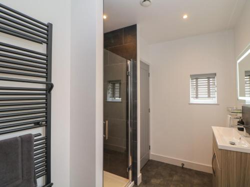 a bathroom with a shower and a sink at Eboracum in Hathersage