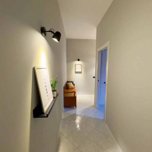 a hallway with a room with a light and a door at TERRA DI SUD Matera - free parking in Matera
