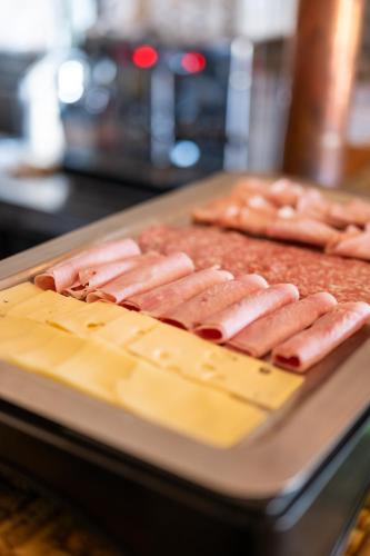 a group of hot dogs on a tray on a table at TENUTA DOROLIVO in Otranto