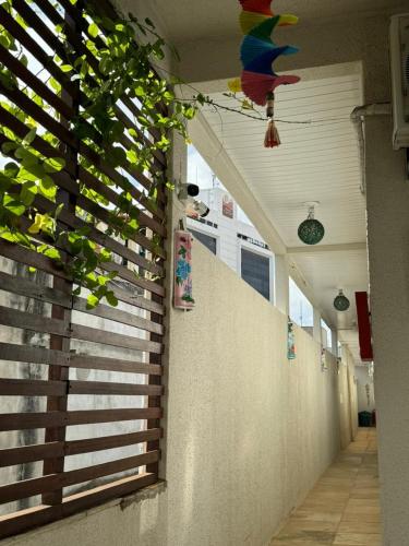 a skateboard on the wall of a hallway at Pousada da Celma in Fortaleza