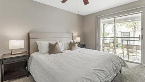 a bedroom with a bed and a large window at Landing Modern Apartment with Amazing Amenities (ID6036X00) in Houston