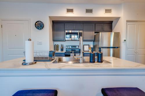 a kitchen with a sink and a refrigerator at 1 BR 1 BA Luxury - Museum District & Downtown HTX in Houston