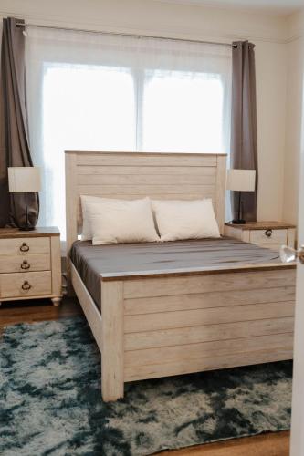 a bedroom with a large bed with a large window at Central Tacoma Triplex in Tacoma